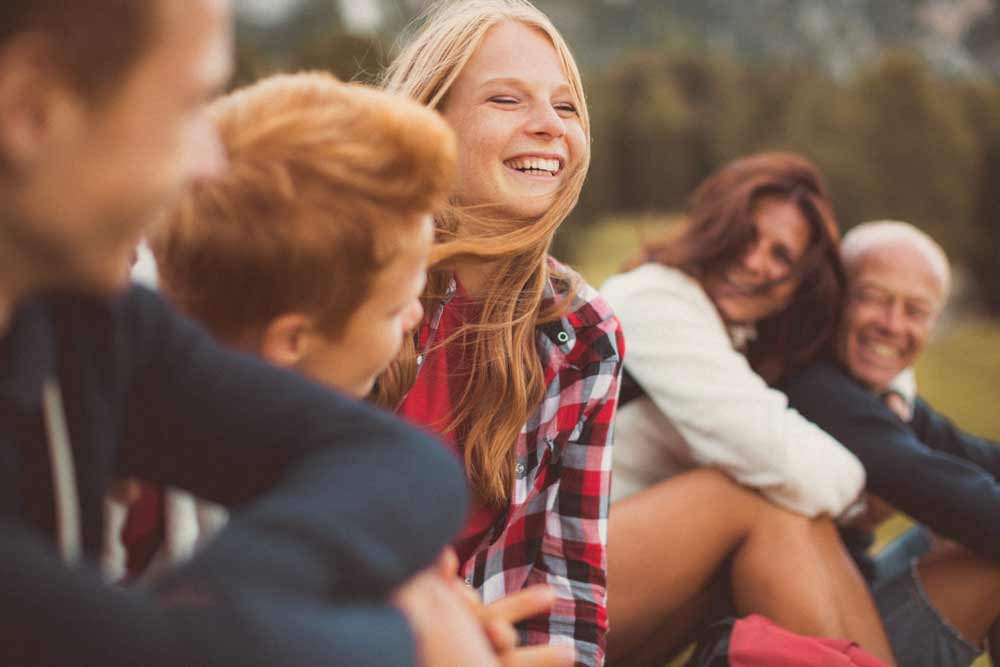 Family with children sitting and smiling